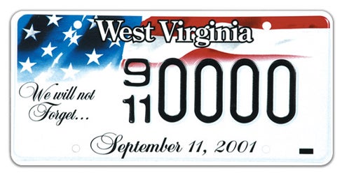 A West Virginia specialty license plate commemorating September 11, 2001, featuring an American flag graphic, the cursive phrase 'We will not Forget...' on the left, 'September 11, 2001' along the bottom, and sample registration 9/11 0000
