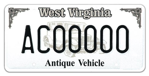A West Virginia specialty license plate labeled 'Antique Vehicle' along the bottom, featuring ornamental corner filigree, a faint background sketch of a vintage automobile, and registration number AC00000
