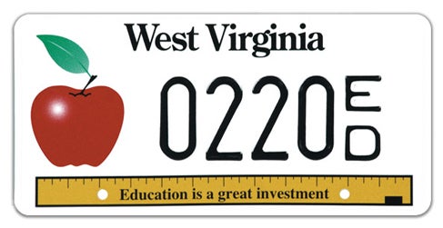 A West Virginia specialty license plate for educators, featuring a red apple icon on the left, a yellow ruler along the bottom reading 'Education is a great investment', and registration number 0220 ED