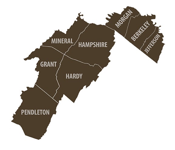 A map highlighting a specific region of West Virginia in dark brown, showing the contiguous counties of Mineral, Hampshire, Morgan, Berkeley, Jefferson, Grant, Hardy, and Pendleton