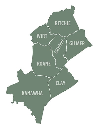 A map highlighting a specific region of West Virginia in green, showing the contiguous counties of Ritchie, Wirt, Calhoun, Gilmer, Roane, Clay, and Kanawha