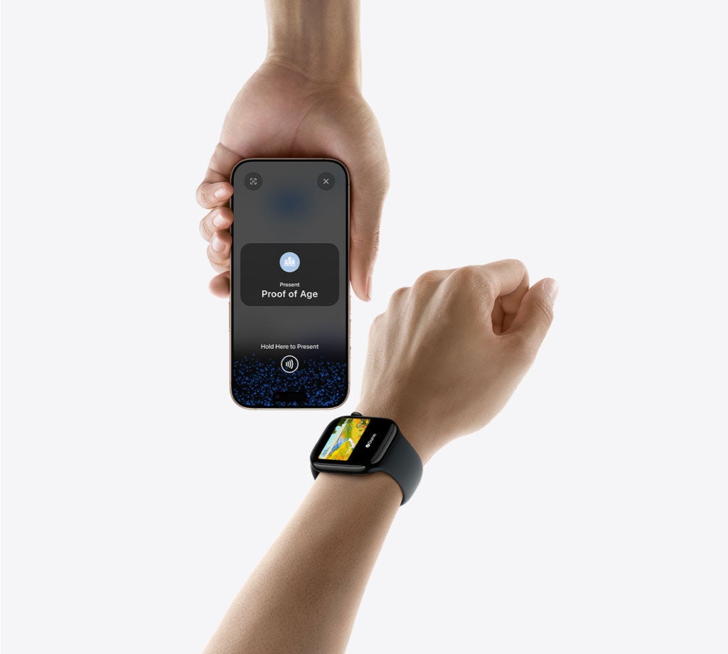 Person using their Apple watch to present their driver's license to a reader to show proof of age.